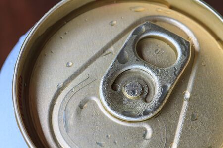 Closeup shot from the pull ring on a beverage can, opened aluminum can with water dropの写真素材