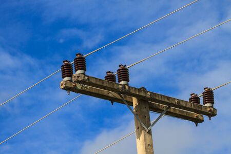 electricity pole on blue sky background in a villageの写真素材