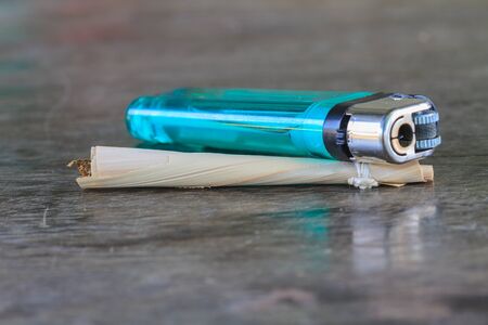 Traditional cigarettes and tobacco isolated on wooden background