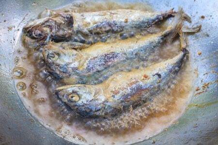 Mackerel fried in a pan,  cooking in the Thai kitchen