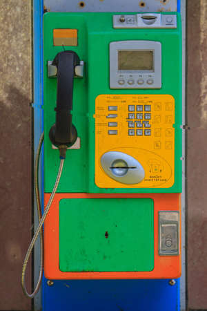close up old public telephone coin in Thailand