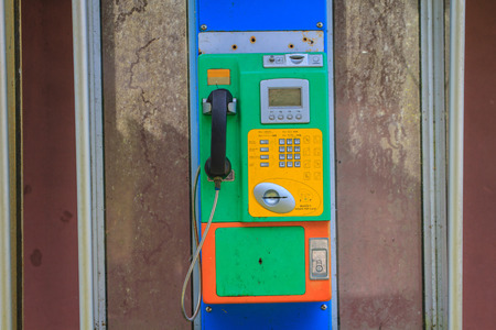 close up old public telephone coin in Thailand