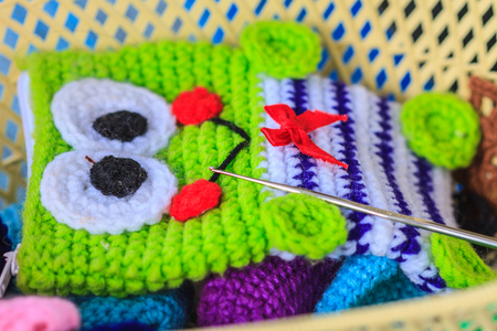 Crochet hook needle on granny square blanket, handmade art and craftsの写真素材