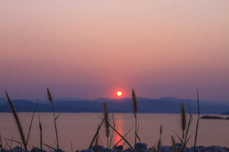 Sunset at lake, Kaengkrachan National Park Thailand,Sunset over lake with the beautiful cloudの写真素材