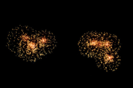 abstract Fireworks light up the dark sky background
