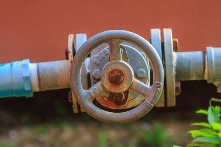 Water valve and steel pipe in gardenの写真素材