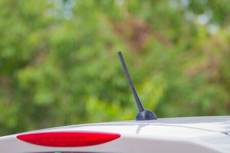 Close up car radio antenna on white carの写真素材