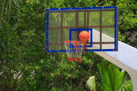 Close up Basket ball heading the hoopの写真素材