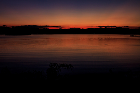 Sunset at lake, Kaengkrachan National Park Thailand,Sunset over lake with the beautiful cloudの写真素材