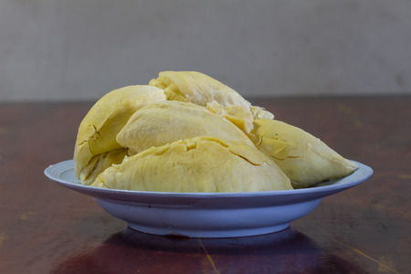 Durian thai fruit on plate on old wood, Durian is tropical fruit so deliciousの写真素材