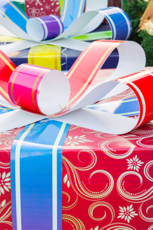 Colorful and striped boxes with gifts tied bowの写真素材