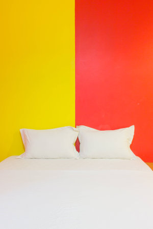 A hotel bedroom with colorful wallの写真素材