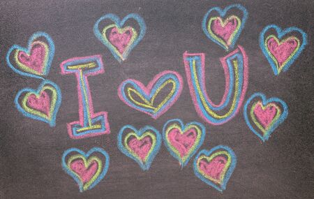 Hand drawn hearts shape on chalkboard background.の写真素材