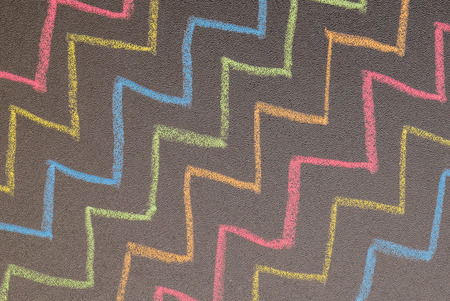 Hand drawn zigzag lines on chalkboard backgroundの写真素材