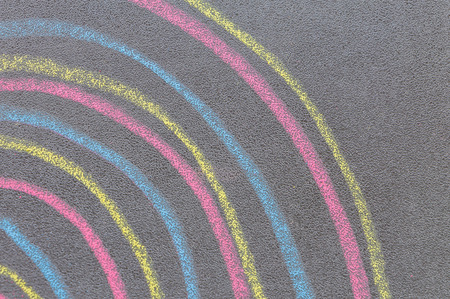 Colorful chalk with spin cycle on chalkboard backgroundの写真素材