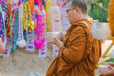 CHIANG MAI ,THAILAND - APRIL 15 : The traditional Songkran festival at pour water onto Buddha image and monks. It is the gesture of worship in Songkran festival at Watphadarabhirom a famous temple on April 15, 2015 in Chiangmai,Thailand.のeditorial素材
