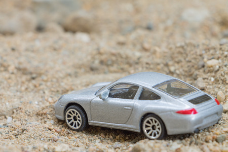CHIANG MAI THAILAND  APRIL 25 2015: Car small toys Miniature representation of porsche on white background produced as children toysのeditorial素材