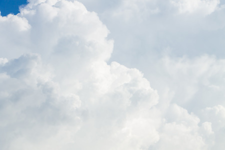 White fluffy clouds in the blue skyの写真素材