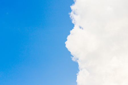 White fluffy clouds in the blue skyの写真素材