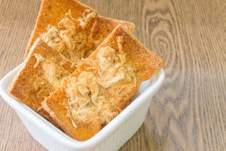 Dried shredded pork with Chillies sauce on Breadの写真素材