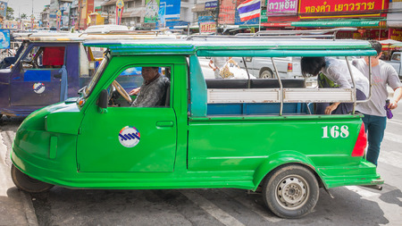 Ayutthaya Thailand - August 22: Auto rickshaw three-weeler tuk-tuk taxi driver   For services to tourists  around Ayutthaya city on Auguust 22 ,2015 ,Ayutthaya Thailandのeditorial素材