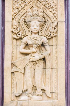 Apsara carvings statue on the wall of Cambodian artの写真素材