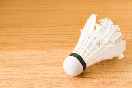 Close up White Shuttlecock on wooden backgroundの写真素材