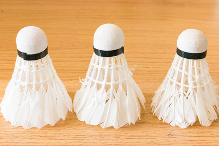 Close up White Shuttlecock on wooden backgroundの写真素材