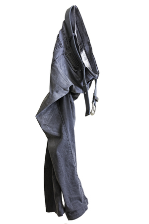 Isolated jeans hang on white backgroundの写真素材
