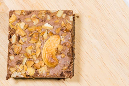 Homemade brownies sliced and  topping on  wooden background