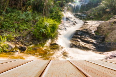 Empty Wooden deck table over blur nature backgroundの写真素材