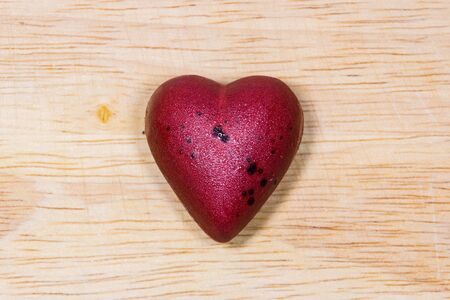 Fancy chocolate on wooden background