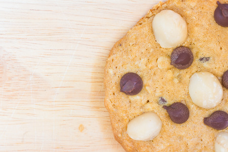 Homemade Cookies, Macadamia and Chocolate Chip on Wooden backgroundの写真素材