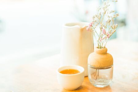 Cup of hot tea on wooden table , soft focusの写真素材
