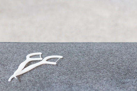 Oral Device :  white dental floss on fabric backgroundの写真素材