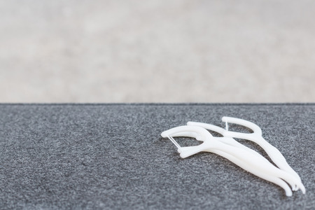 Oral Device :  white dental floss on fabric backgroundの写真素材