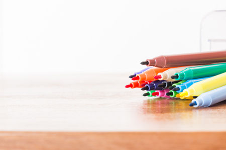 Color pen  on wooden tableの写真素材