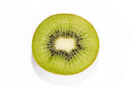 Cross section of ripe kiwi on white backgroundの写真素材