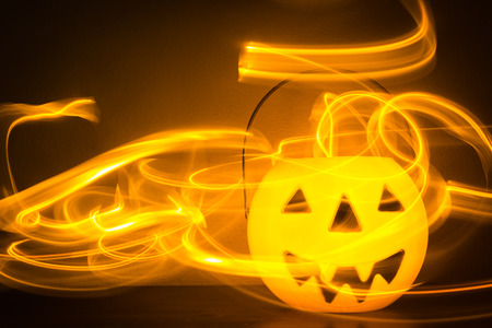 Scary Halloween background with pumpkins on blackの写真素材