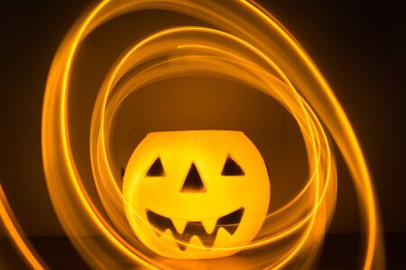 Scary Halloween background with pumpkins on blackの写真素材
