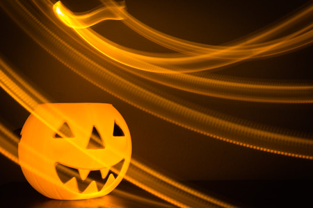 Scary Halloween background with pumpkins on blackの写真素材
