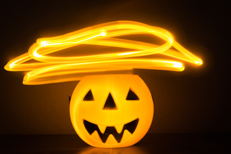 Scary Halloween background with pumpkins on blackの写真素材