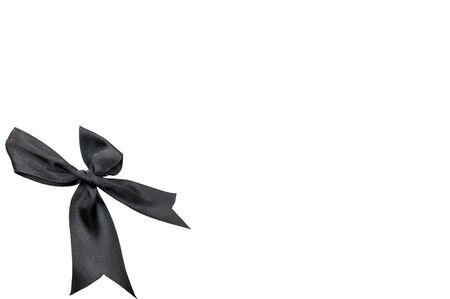 Black ribbon bow isolated on white backgroundの写真素材