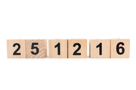 Wooden block calendar with 25 December 2016 on white background