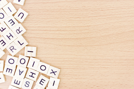 Wooden blocks with alphabet on wooden floor backgroundの写真素材