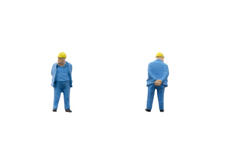 Miniature people worker construction concept on white background with clipping pathの写真素材
