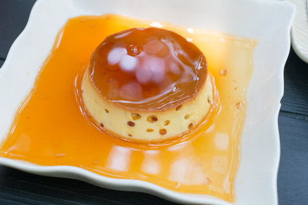Creme caramel , Caramel custard , Custard pudding on wooden tableの写真素材