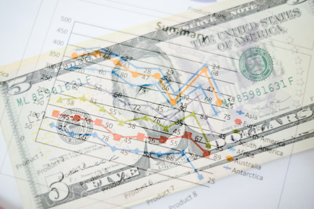 Double exposure of graph and dollars banknotes  for finance and business conceptの写真素材