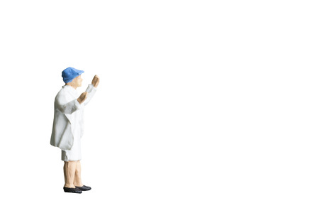 Miniature people isolated on white background with clipping pathの写真素材