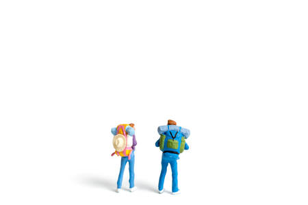 Miniature Backpacker  isolated on white background ,Travel conceptの写真素材